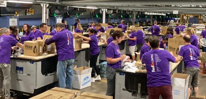 FedEx volunteers pack 2,400 food boxes to support Ukrainian refugees