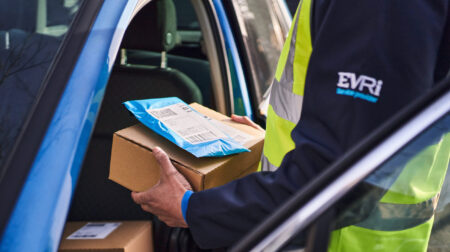 Evri and GMB Union announce pay deal for couriers An Evri delivery worker handles a parcel.
