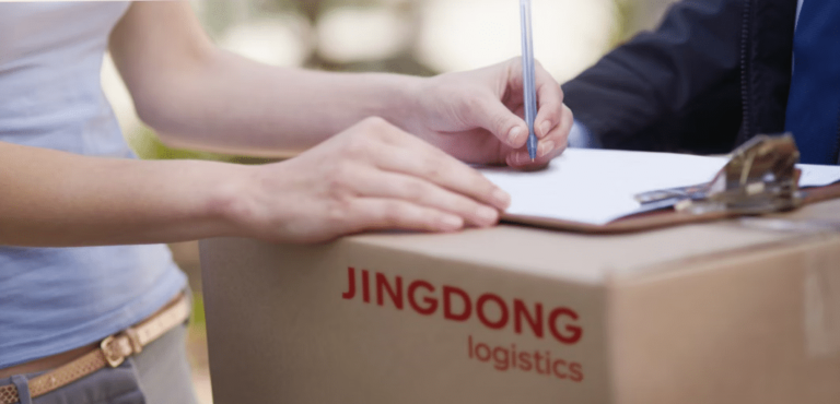 JD Logistics expands international express delivery service A person signing a package being delivered by JD.com