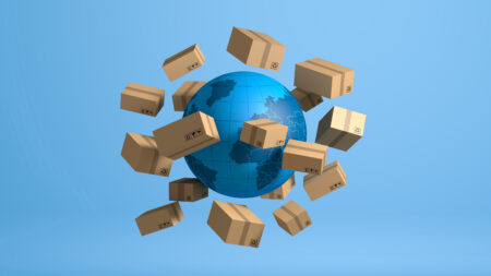 Brown parcel boxes rotating around a blue world globe