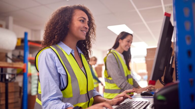 Whistl launches express delivery apprenticeship Whistl launches express delivery apprenticeship Female Staff In Busy Modern Warehouse Working On Computer Terminals.