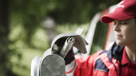 bpost worker delivering a newspaper