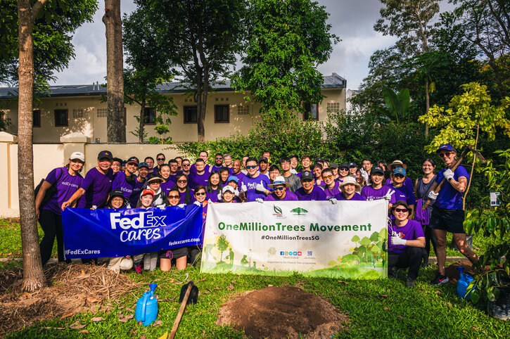FedEx Express boosts sustainability efforts with tree-planting initiative The FedEx Express Singapore team of volunteers with banners and tree planting equipment