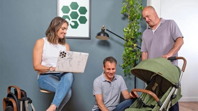 FedEx awards US$230,000 to 10 small businesses Customers looking at a Bombi stroller.