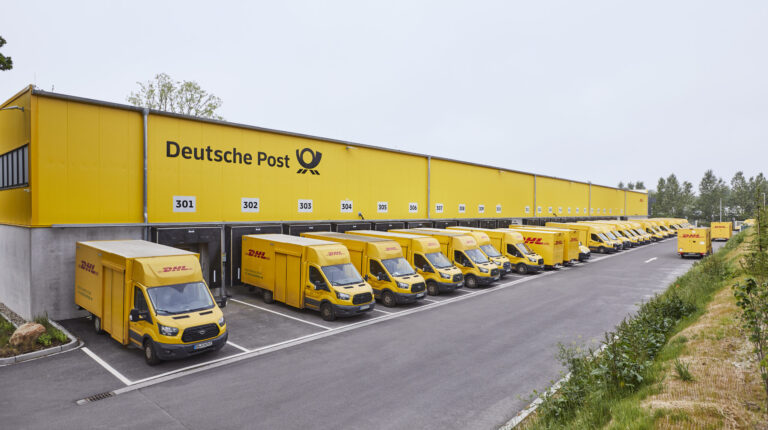 German parliament approves postal law changes Deutsche Post vans outside depot