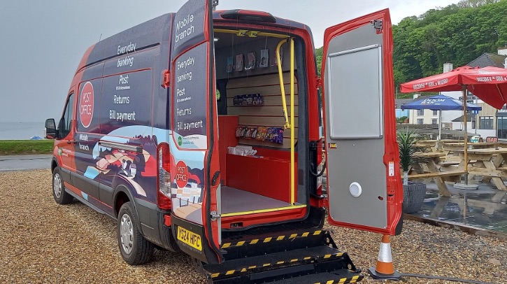 First electric Mobile Post Office trialled in Wales First electric mobile Post Office trialled in Wales The Post Office's first electric mobile Post Office sits parked with its backdoors open.