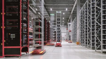 Inside one of JD's automated warehouses with robots on the floor.