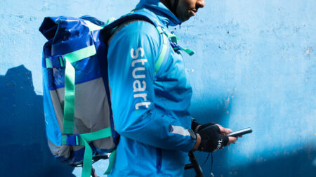 Stuart bike courier using mobile phone