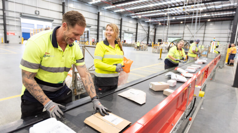 Australia Post opens A$12m parcel facility Aus Post works at the sorting line in the new Gold Cost parcel facility