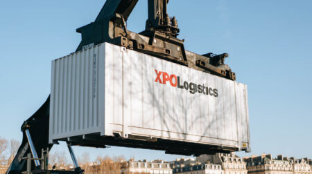 XPO Logistics launches multimodal Belgium-Turkey transportation corridor White XPO Logistics container being lifted by crane.