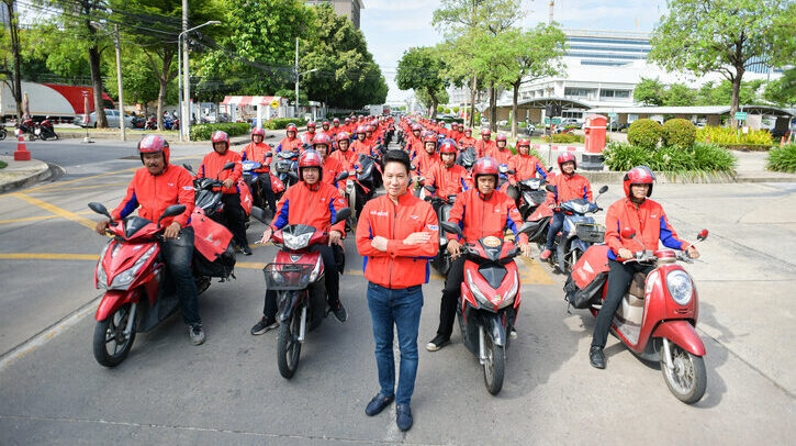 EXCLUSIVE INTERVIEW: Thailand Post Thailand Post CEO Dr Dhanant Subhadrabandhu with his staff on bikes