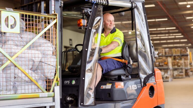 Australia Post worker on a forklift