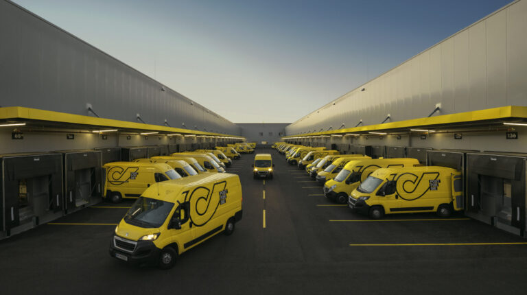 Austrian Post sees strong financial results in first half of 2024 Yellow Austrian Post vans at parcel terminals