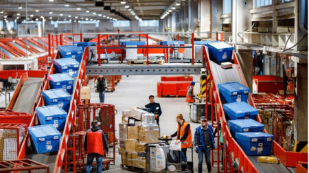 Nova Post sorting center with blue parcel boxes on red sorting line