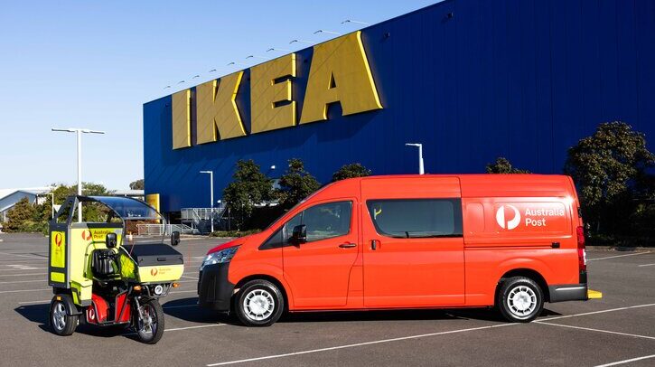 Australia Post becomes e-commerce fulfillment partner for IKEA Red Australia Post van and e-cargo bike outside blue warehouse with yellow IKEA logo