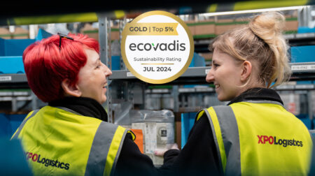 XPO Logistics wins gold for sustainability efforts XPO Logistics workers with high vis jackets and EcoVardis logo between them