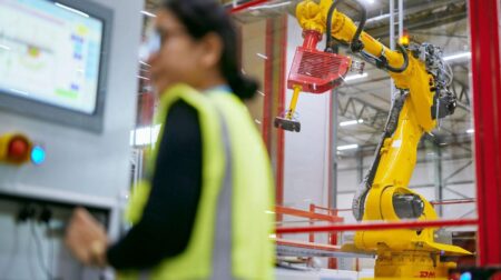 AI and sustainability continue to shape logistics, DHL reports Robotic arm helping human worker