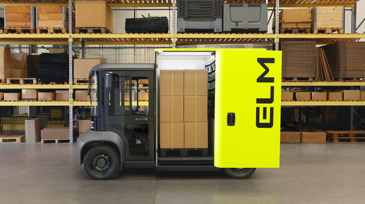 Barclays backs ELM Mobility’s last-mile delivery e-vehicle Evolv van in warehouse with yellow door open, showing brown parcels inside