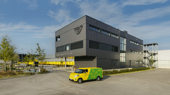 Austrian Post building with green and yellow van outside