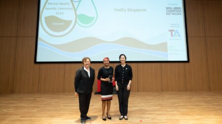 FedEx wins fourth consecutive award for mental health awareness FedEx employees collecting the award