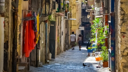ANALYSIS: Navigating the last mile delivery challenge presented by historic urban environments Empty street at the city of Naples, Italy