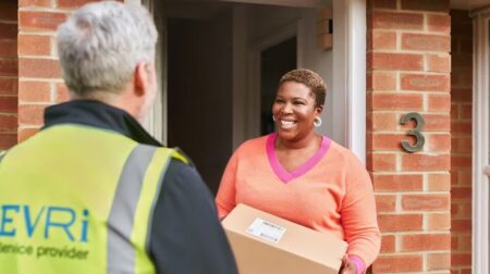 Evri announces record year with 730 million parcels delivered Woman receiving parcel on doorstep from Evri delivery man