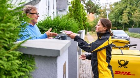 DHL to cut 8,000 jobs as market remains volatile in 2025 Deutsche Post deliverer delivers letter post.