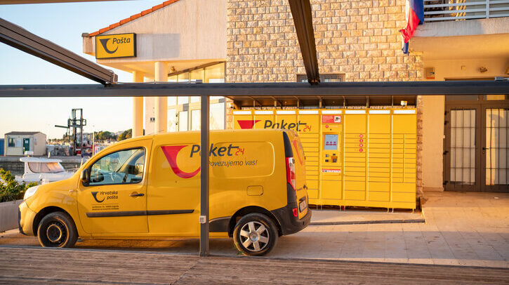 Croatian Post reduced emissions by 18% in 2024 Croatian post office, a yellow branded "Paket 24" car for transporting parcels and a parcel terminal in the town of Novalja on the island of Pag.