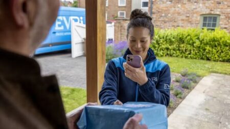 Evri to hire 5,000 new couriers to boost parcel delivery business An Evri worked delivers a parcel on the doorstep.