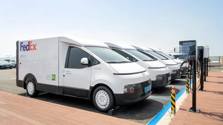 FedEx adds more electric vehicles to Korean fleet A row of FedEx electric vans are parked at charging points