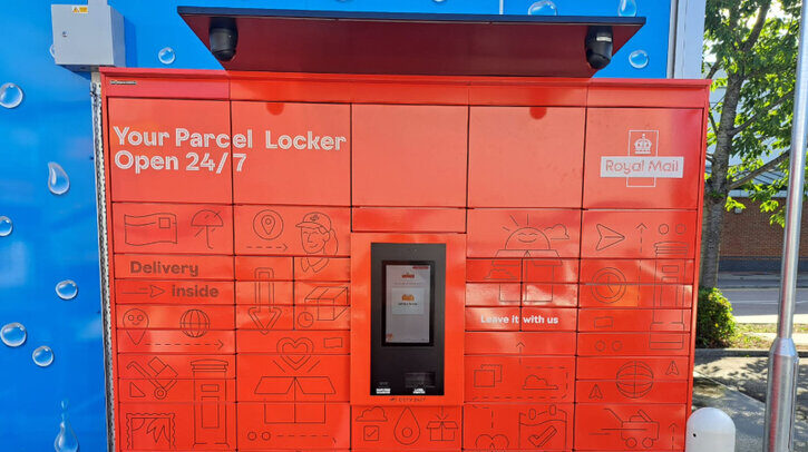 Royal Mail to roll out parcel lockers at 500 Motor Fuel Group petrol stations A bank of exterior red parcel lockers with the Royal Mail logo on the top right and a blue wall behind