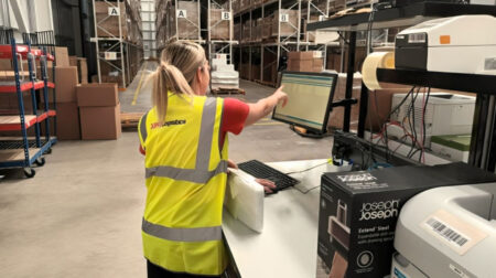 XPO Logistics signs as logistics partner for UK homewares company Joseph Joseph An XPO Logistics team member in a yellow high-vis jacket handles a package while working on a digital touchscreen in a warehouse