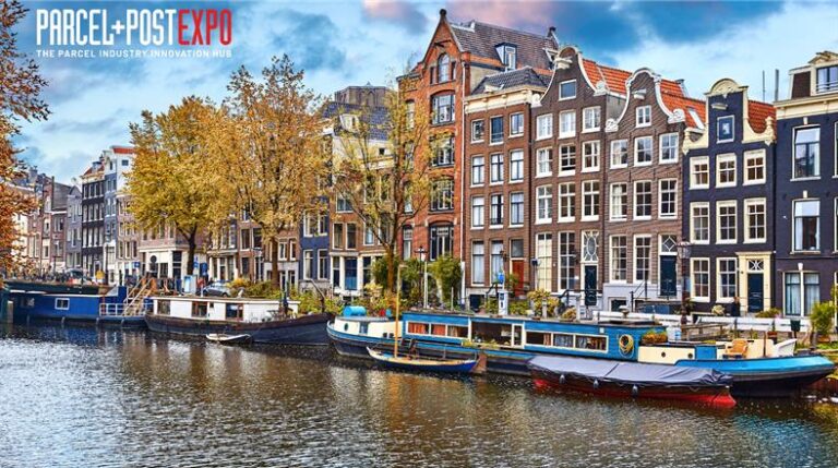Parcel+Post Expo 2025: Packed with new feature zones, all-new exhibitors and a Leadership Conference to challenge and inspire A photo of a canal in Amsterdam with a bright blue sky and boats moored along the edge of the water