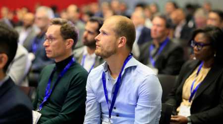 Parcel+Post Expo 2025: Hear from 35+ thought leaders at the Leadership Conference Attendees sit in rows at the conference at Parcel+Post Expo listening to a presentation