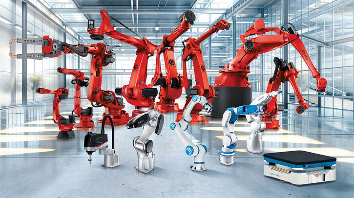 A range of logistics automation machinery lined up for display, with larger red machinery at the back and smaller white and grey machinery in the front