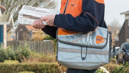 PostNL asks government to remove USO designation PostNL delivery worker with branded satchel and mail in hand