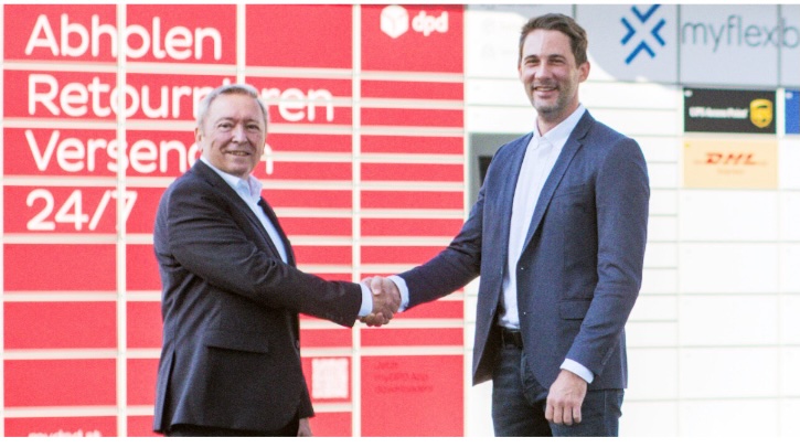 DPD Austria grows locker network with expanded MyParceLocker partnership DPD Austria managing director Rainer Schwarz and Jonathan Grothaus, CEO and founder of MyFlexBox shake hands in front of a bank of branded parcel lockers