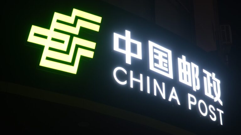 China’s express parcel volumes top 150 billion A large neon sigh saying 'China Post', illuminated a night-time