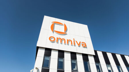 Omniva delivers record-breaking 50 million parcels globally A large office building with 'Omniva' written on the exterior.