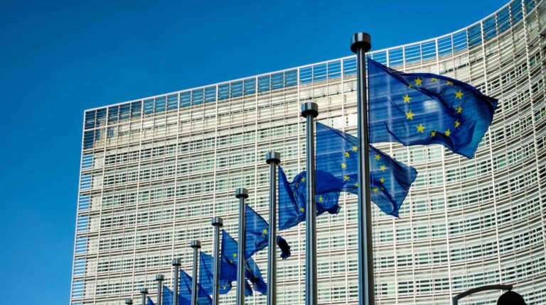 EU member states approve €3 customs duty on low-value e-commerce parcels EU head office with European Union flags flying out the front under a blue sky