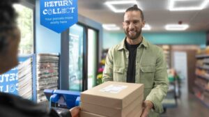 An Evri customer drops off a parcel at a parcel shop.