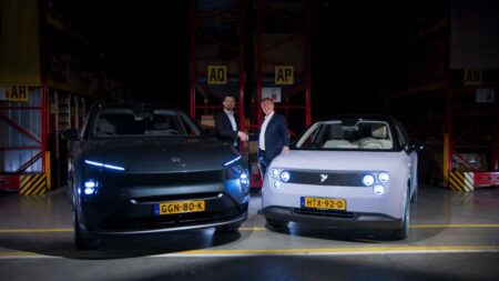 Nio selects DHL for European EV aftermarket logistics Representatives of Nio and DHL shake hands in front of two Nio electric vehicles.