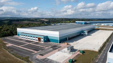 Evri invests £4m in new Barnsley fulfillment center Aerial view of Evri's new £4m Barnsley fulfillment center. It has a grey roof and white and green sides. Green fields stretch out into the distance.