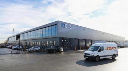 A QLS warehouse with a GOFO delivery van parked outside.