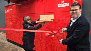 Ribbon being cut at opening of Royal Mail lockers at The Junction Retail & Leisure Park.
