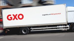 A white GXO truck, with company name in red.