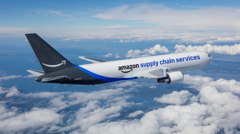 An Amazon aircraft in flight, with Supply Chain Services written along the side.