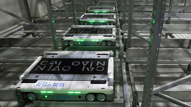 Cainiao’s self-developed green and white warehouse robots in operation