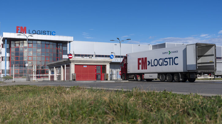 FM Logistic to acquire Schäflein to accelerate European growth An FM Logistic delivery truck is parked at a logistics facility.