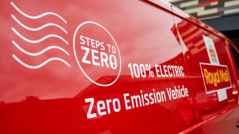 Royal Mail cuts carbon emissions by 31% The side of a Royal Mail delivery van, with the company branding and logo alongside 'Steps to zero", "zero-emission vehicle" and "100% electric" written on it in white.